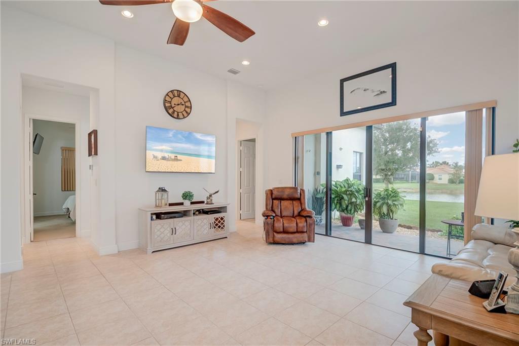 5239 Ferrari Avenue Ave Maria, FL 34142 - Photo 7 of 30 a bedroom with furniture and a large window