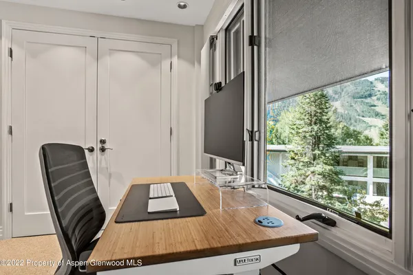 a view of a balcony with furniture and window