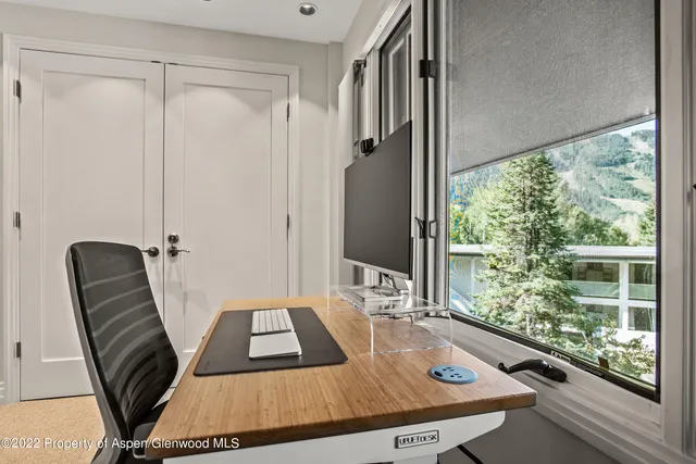 a view of a balcony with furniture and window