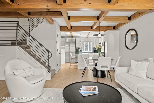 a living room with furniture and a clock