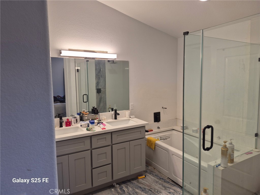 2282 North Smoketree Avenue Rialto, CA 92377 - Photo 11 of 15 a bathroom with a double vanity sink mirror and double