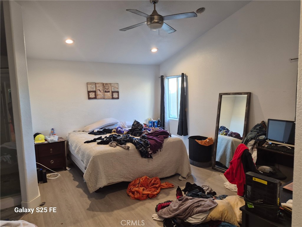 2282 North Smoketree Avenue Rialto, CA 92377 - Photo 13 of 15 a bedroom with a bed and a tv