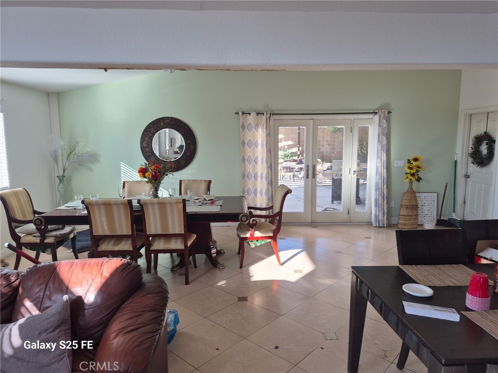 2282 North Smoketree Avenue Rialto, CA 92377 - Photo 5 of 15 a living room with furniture and a large window