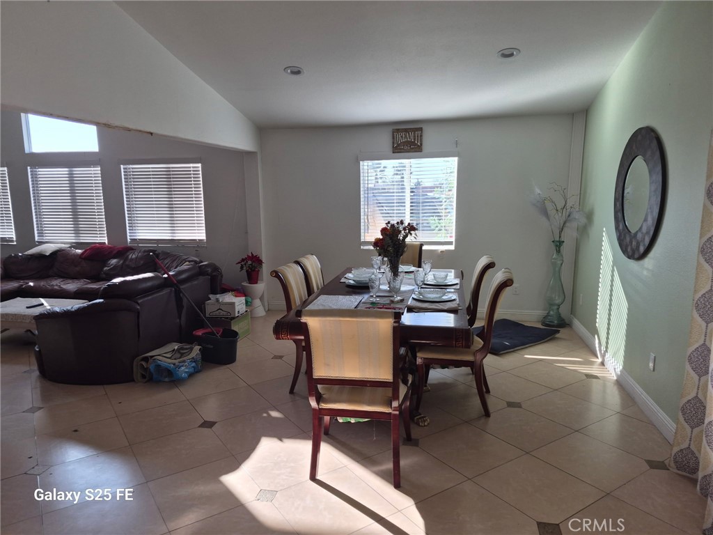 2282 North Smoketree Avenue Rialto, CA 92377 - Photo 7 of 15 a dining room with furniture and a floor to ceiling window
