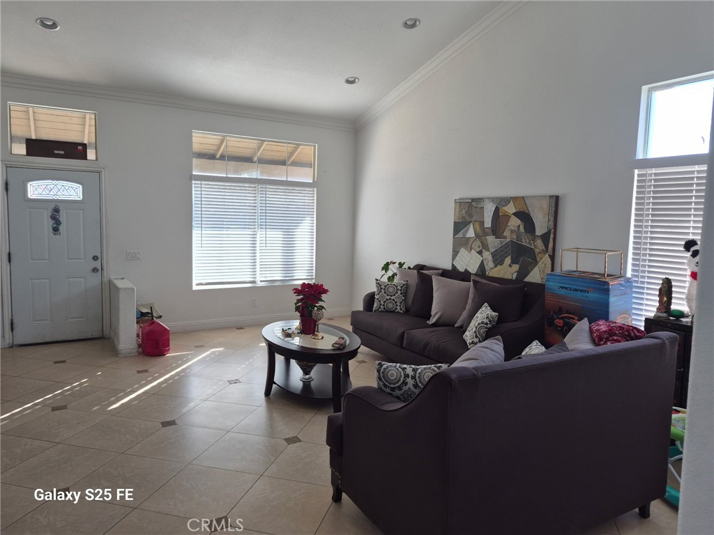 2282 North Smoketree Avenue Rialto, CA 92377 - Photo 8 of 15 a living room with furniture and a window