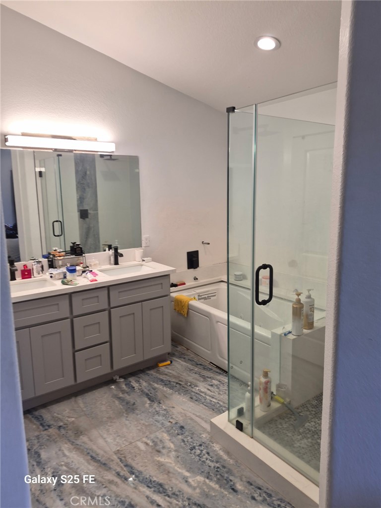 2282 North Smoketree Avenue Rialto, CA 92377 - Photo 10 of 15 a bathroom with a double vanity sink mirror and toilet