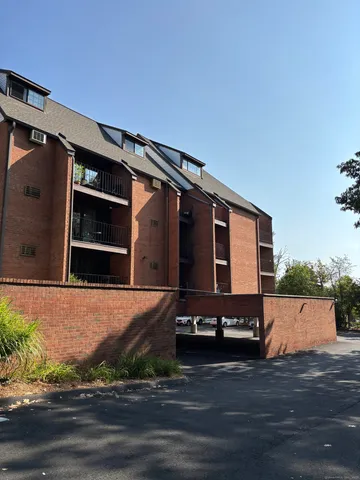 a view of house with backyard and tree