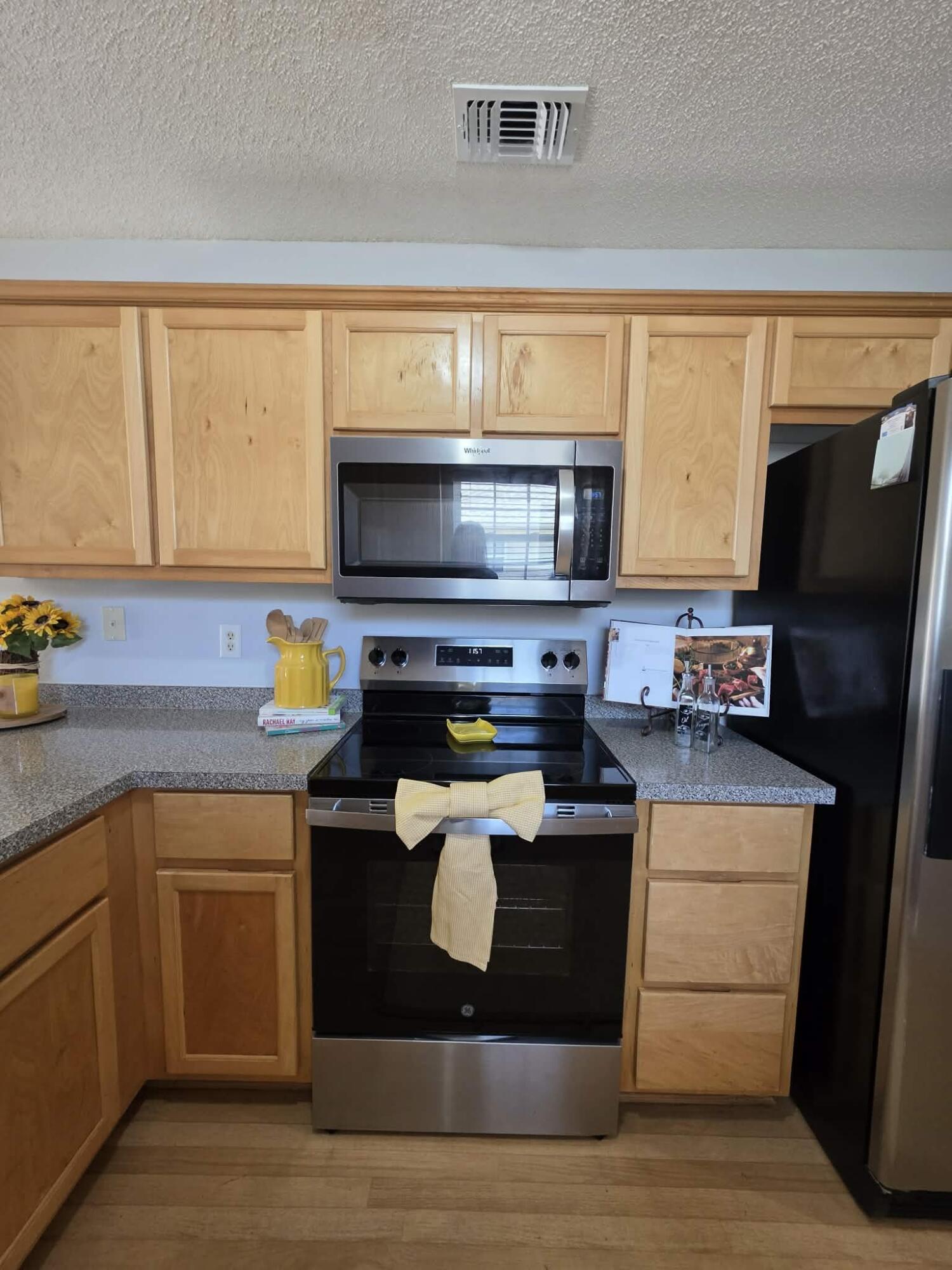 8347 Tavira Street Navarre, FL 32566 - Photo 18 of 49 a kitchen with a sink appliances and cabinets