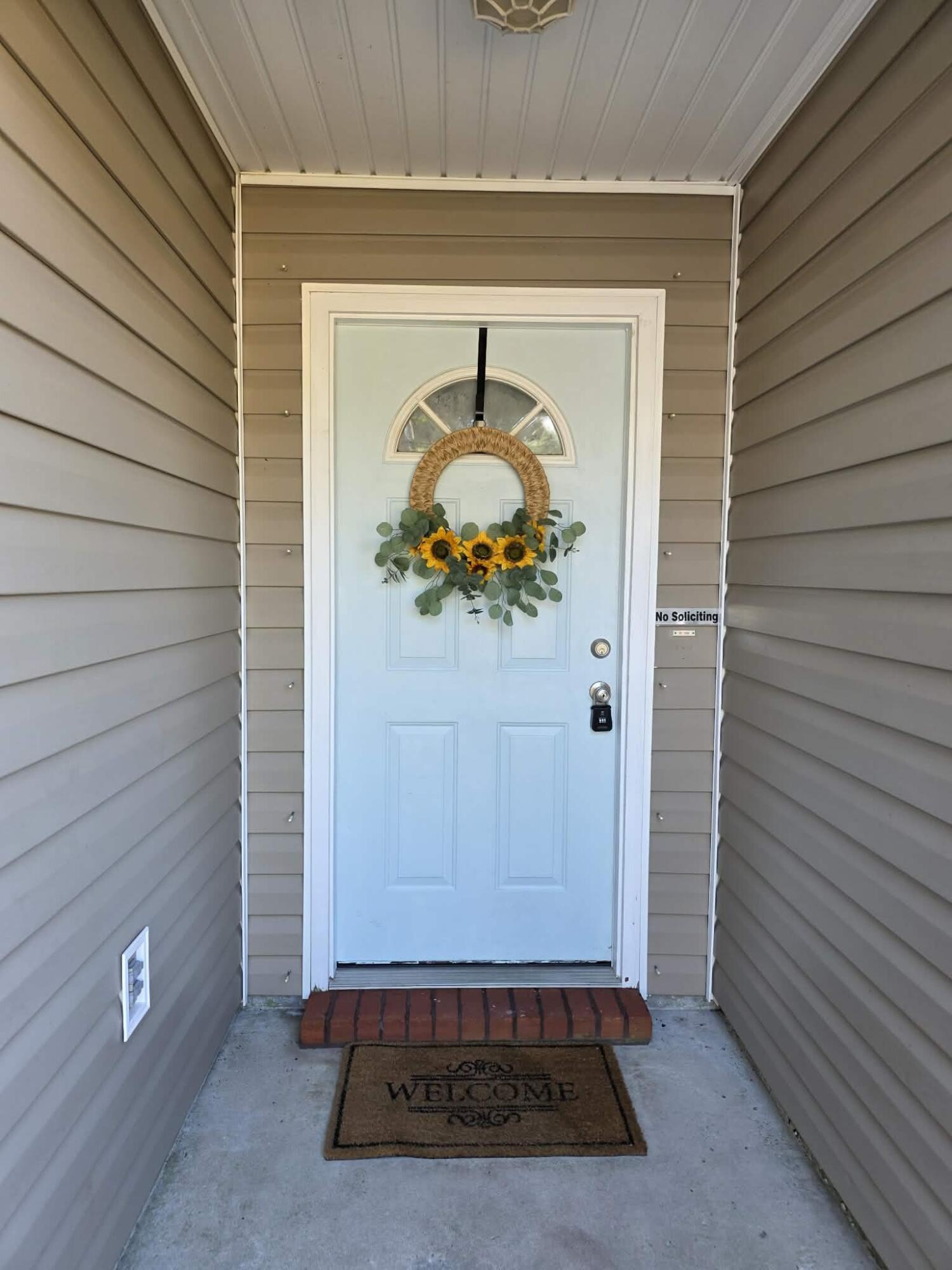 8347 Tavira Street Navarre, FL 32566 - Photo 2 of 49 a front view of a house with parking