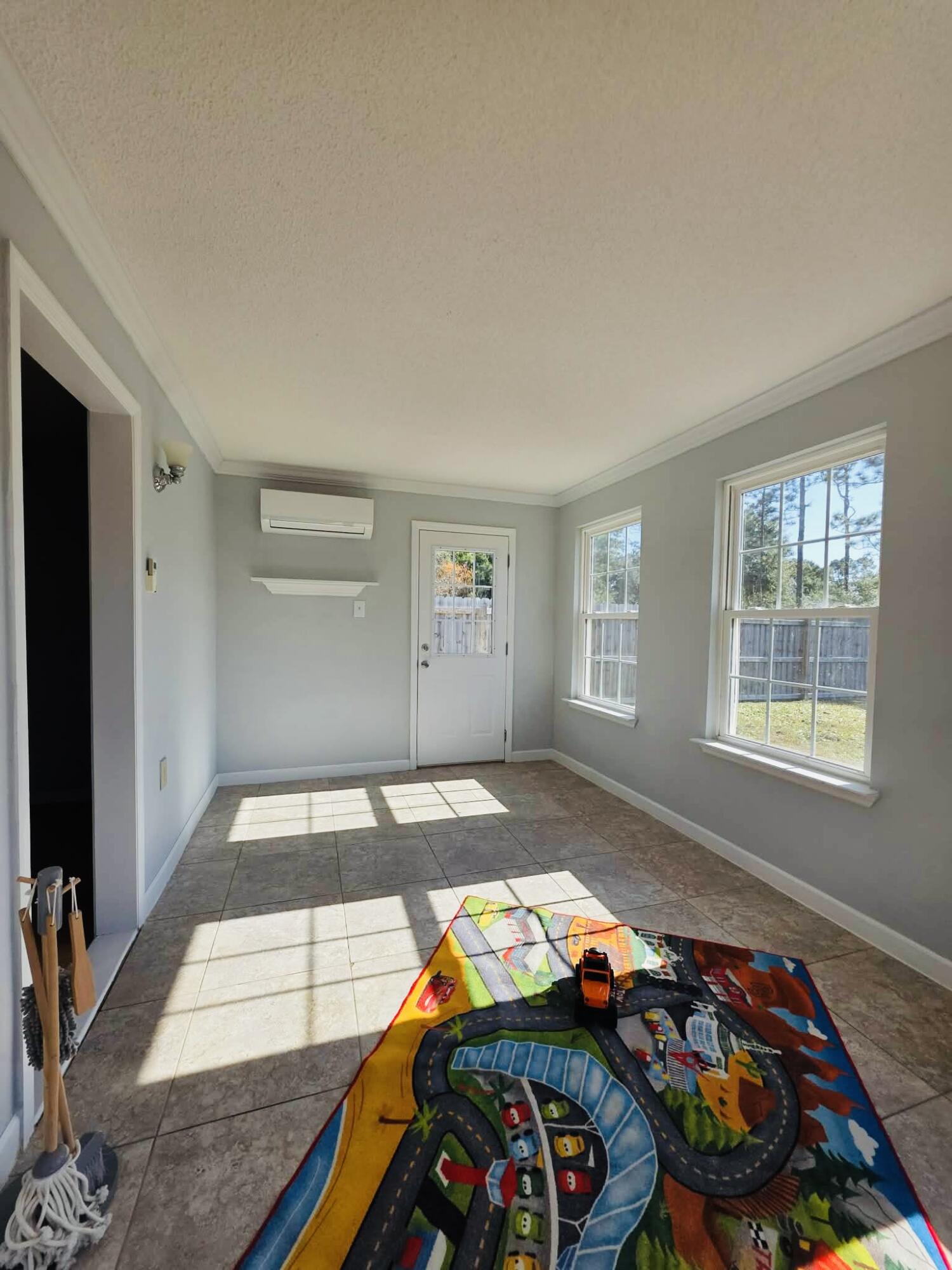 8347 Tavira Street Navarre, FL 32566 - Photo 24 of 49 a bedroom with bed and a window