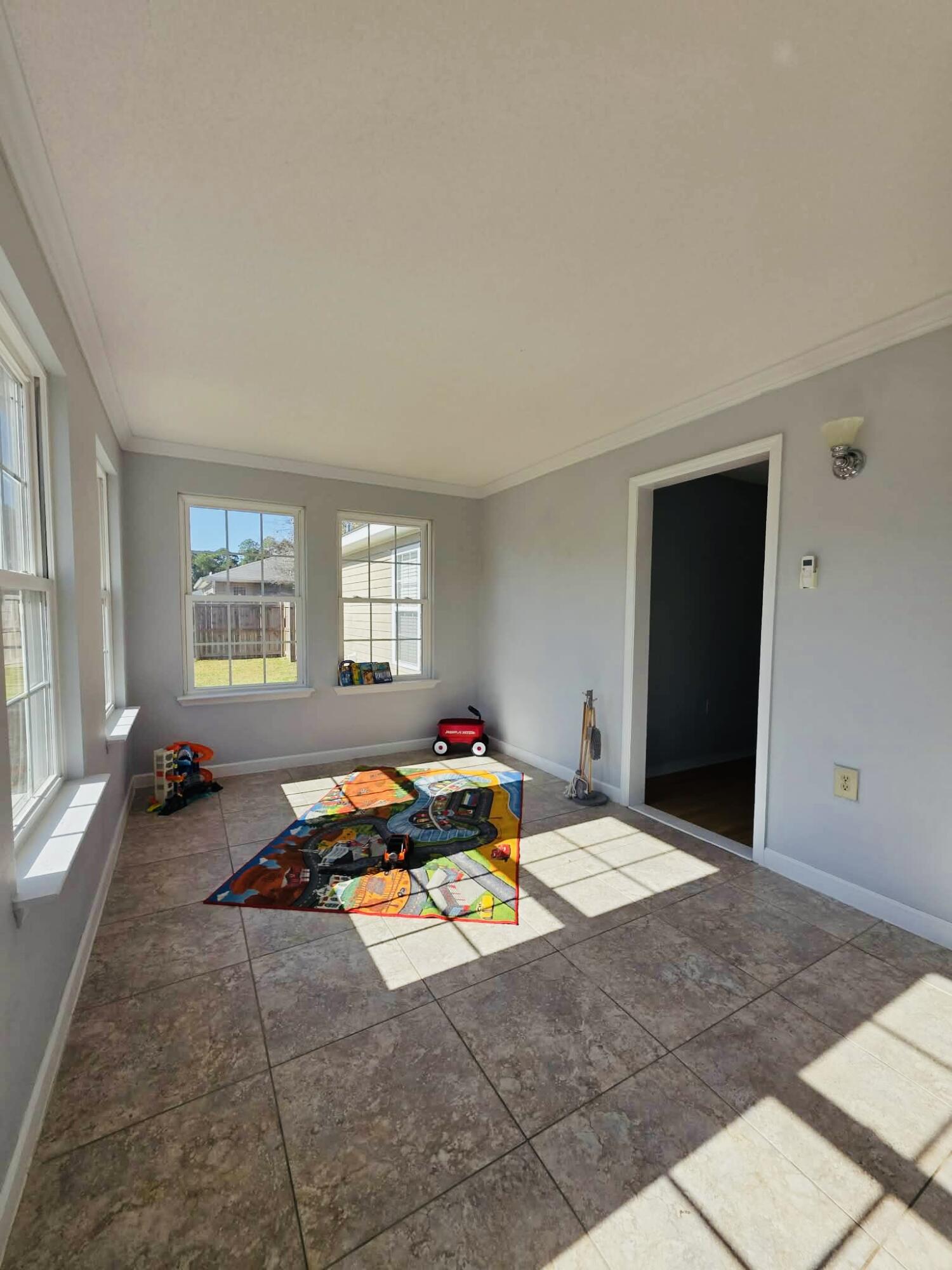 8347 Tavira Street Navarre, FL 32566 - Photo 25 of 49 a bedroom with furniture and a window