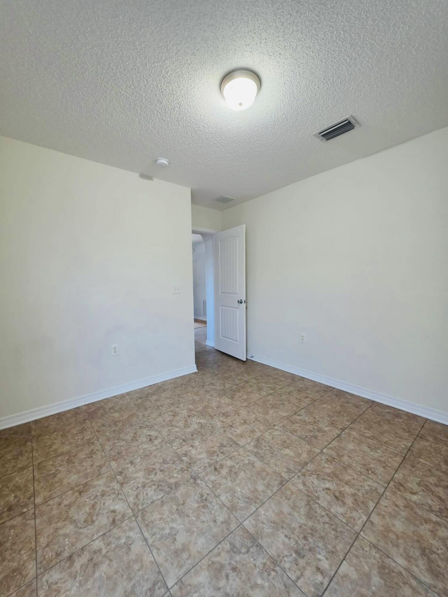 8347 Tavira Street Navarre, FL 32566 - Photo 30 of 49 a view of an empty room