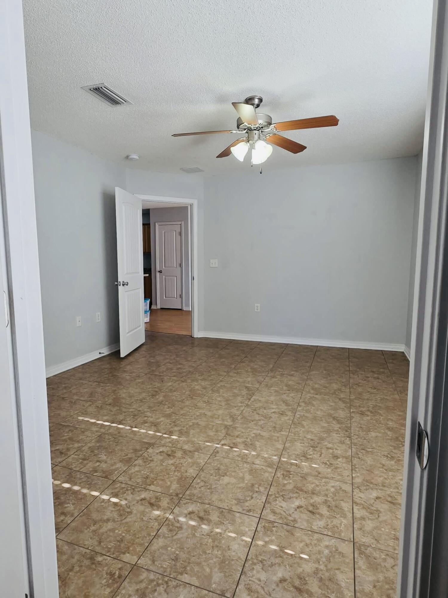 8347 Tavira Street Navarre, FL 32566 - Photo 35 of 49 a view of an empty room with a window