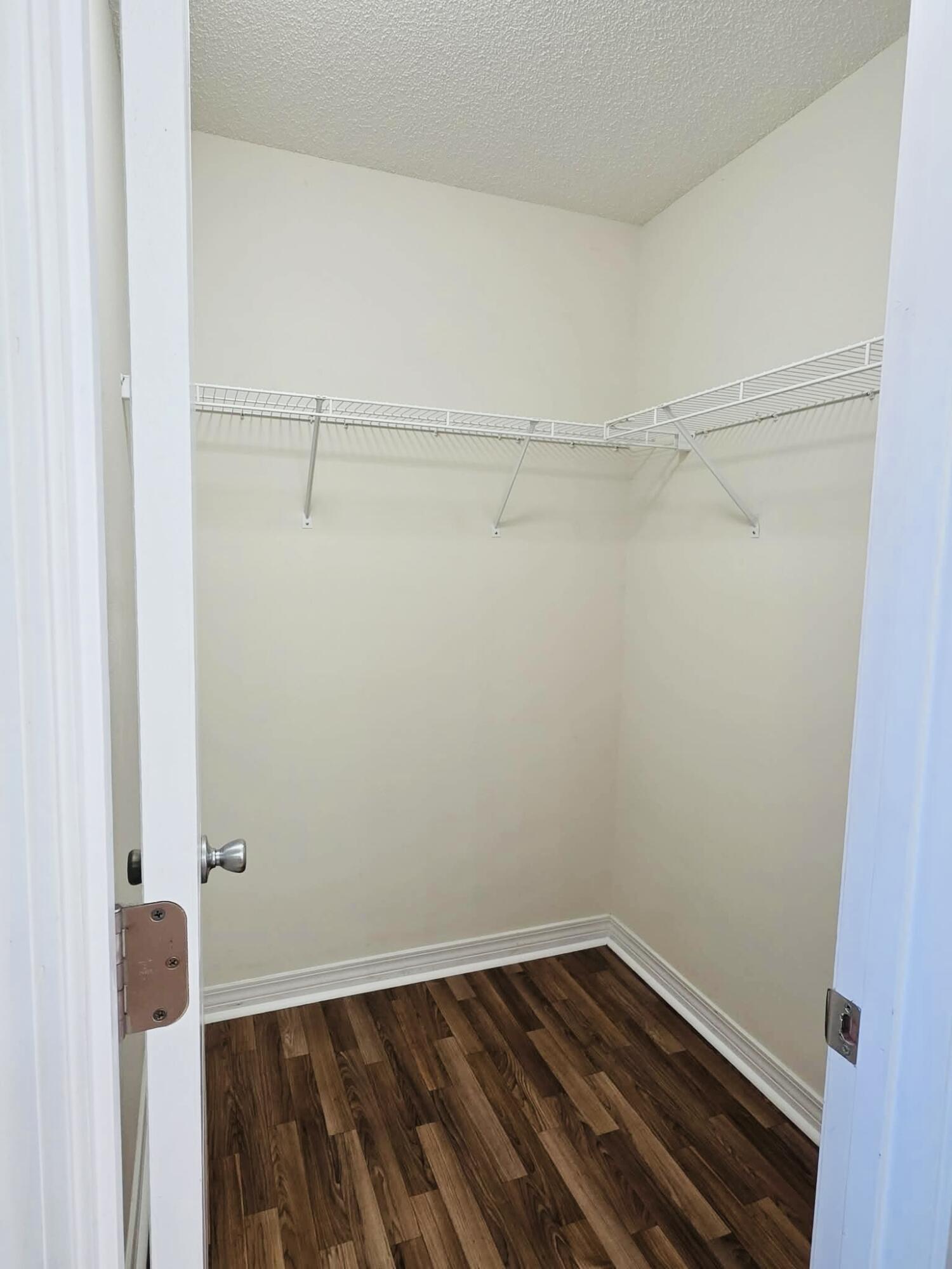 8347 Tavira Street Navarre, FL 32566 - Photo 36 of 49 a view of a room with racks on the wall