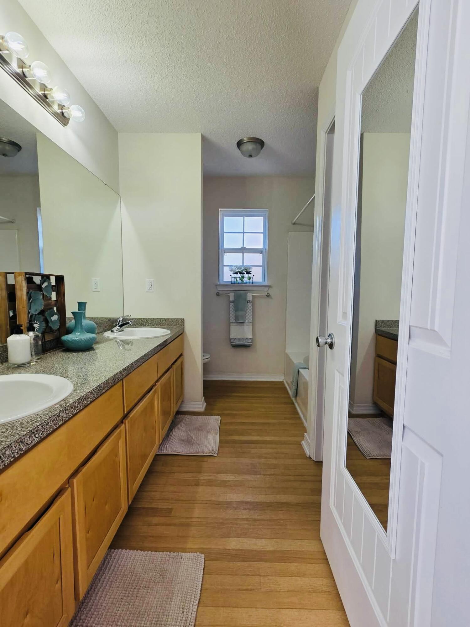 8347 Tavira Street Navarre, FL 32566 - Photo 39 of 49 a bathroom with sink and mirror