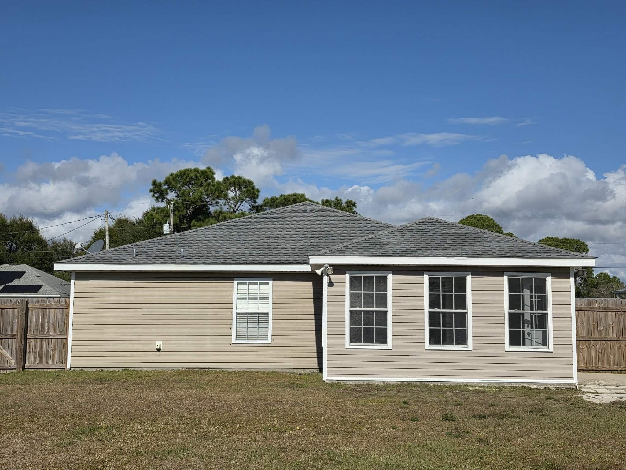 8347 Tavira Street Navarre, FL 32566 - Photo 44 of 49 a front view of a house with a garage