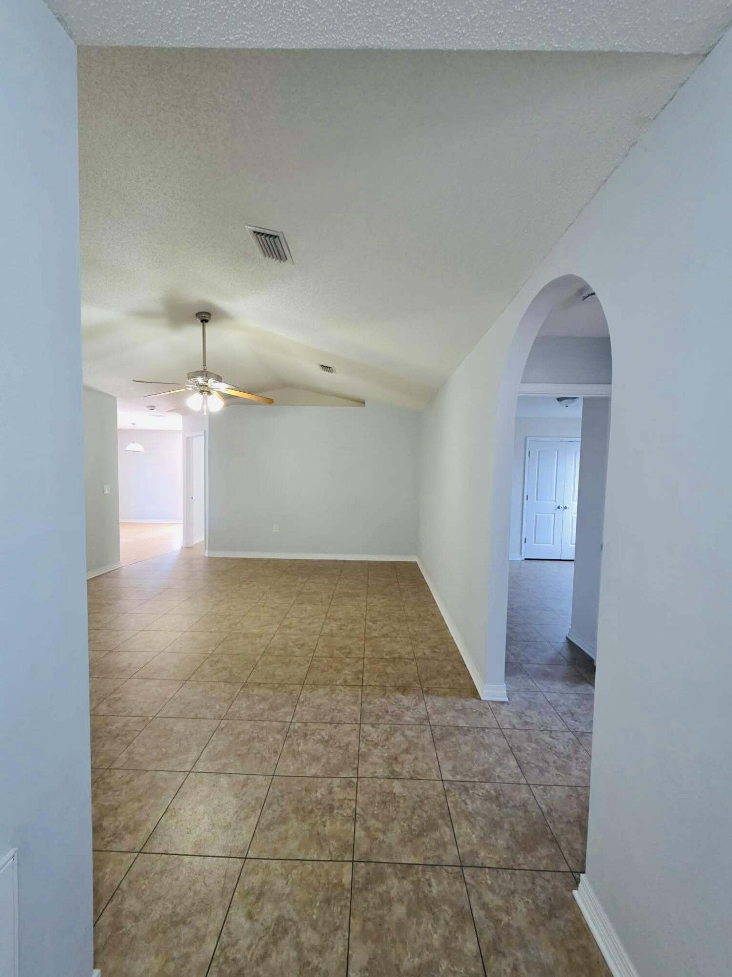 8347 Tavira Street Navarre, FL 32566 - Photo 7 of 49 a view of a room with a sink and cabinets