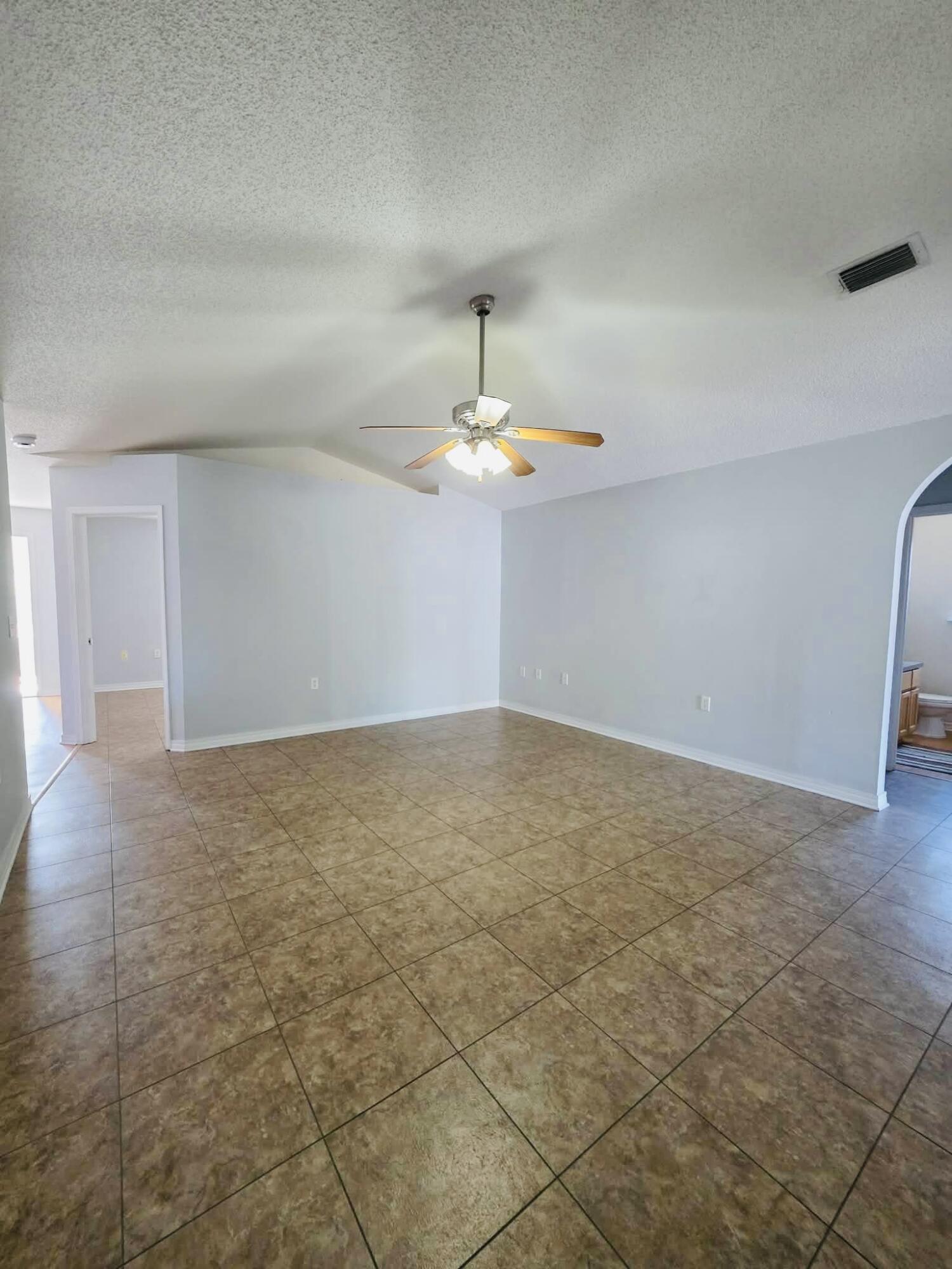 8347 Tavira Street Navarre, FL 32566 - Photo 8 of 49 a view of empty room with wooden floor