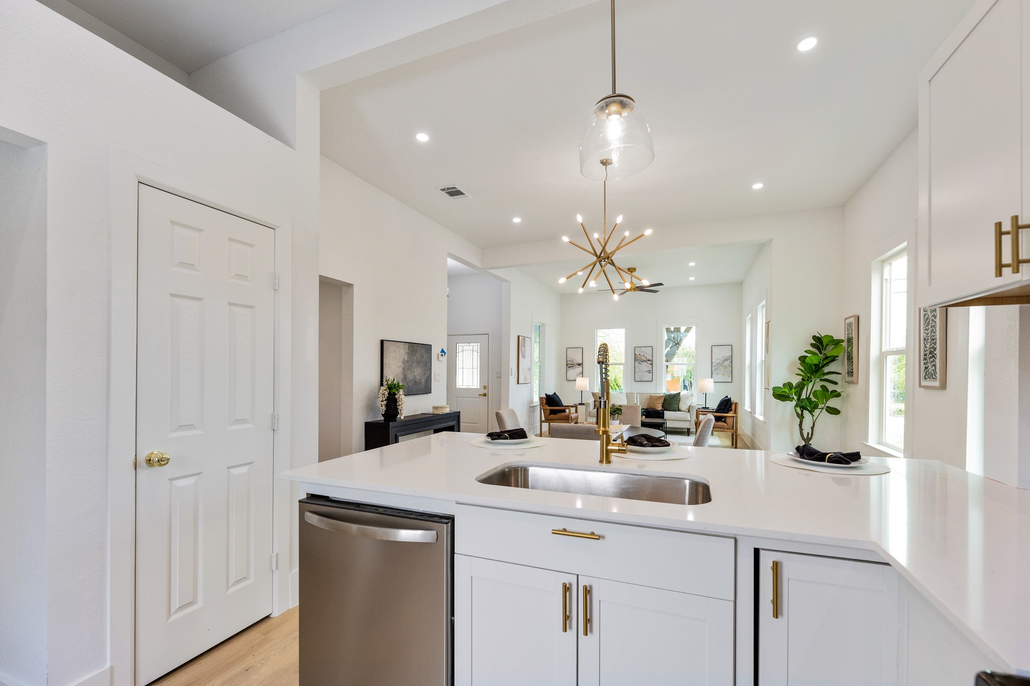 910 West 4th Street Taylor, TX 76574 - Photo 38 of 38 a kitchen with counter top space and living room view
