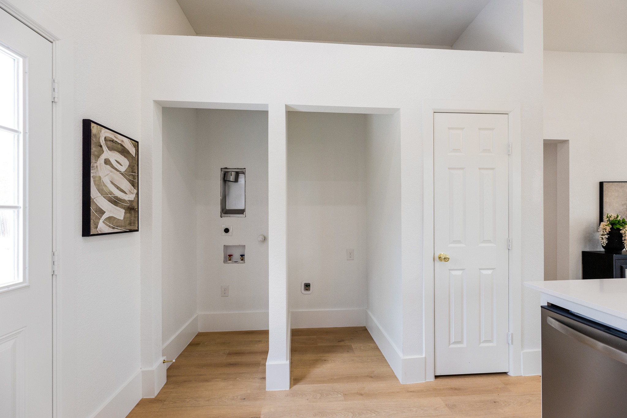 910 West 4th Street Taylor, TX 76574 - Photo 16 of 38 a view of a hallway with wooden floor and closet