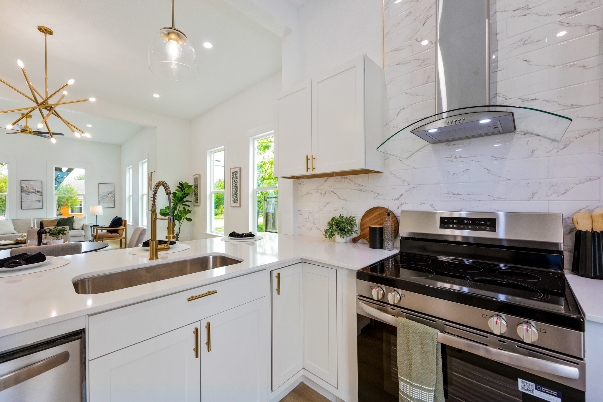 910 West 4th Street Taylor, TX 76574 - Photo 17 of 38 a kitchen with kitchen island a counter appliances and cabinets