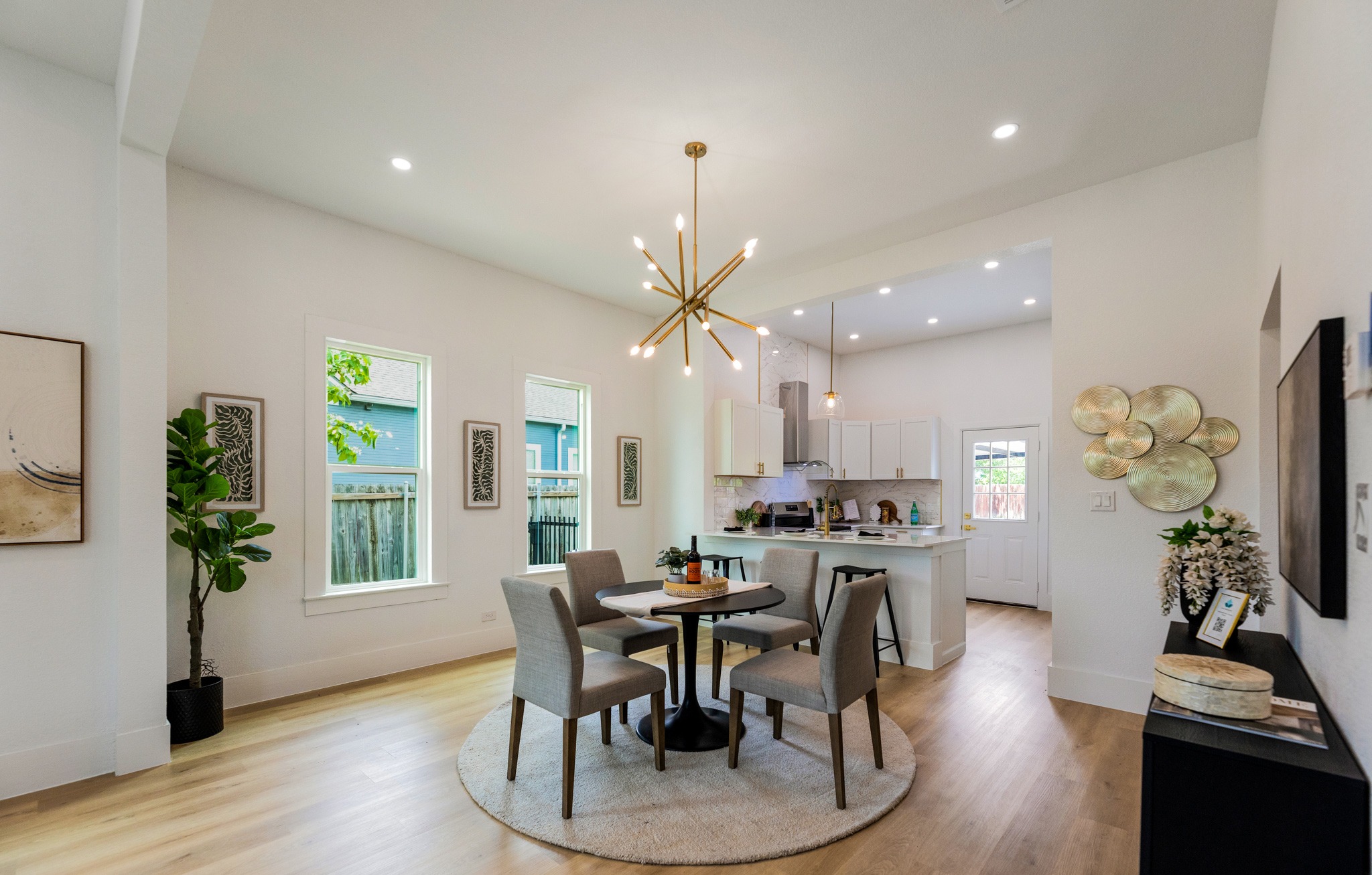 910 West 4th Street Taylor, TX 76574 - Photo 19 of 38 a view of a dining room with furniture window and wooden floor