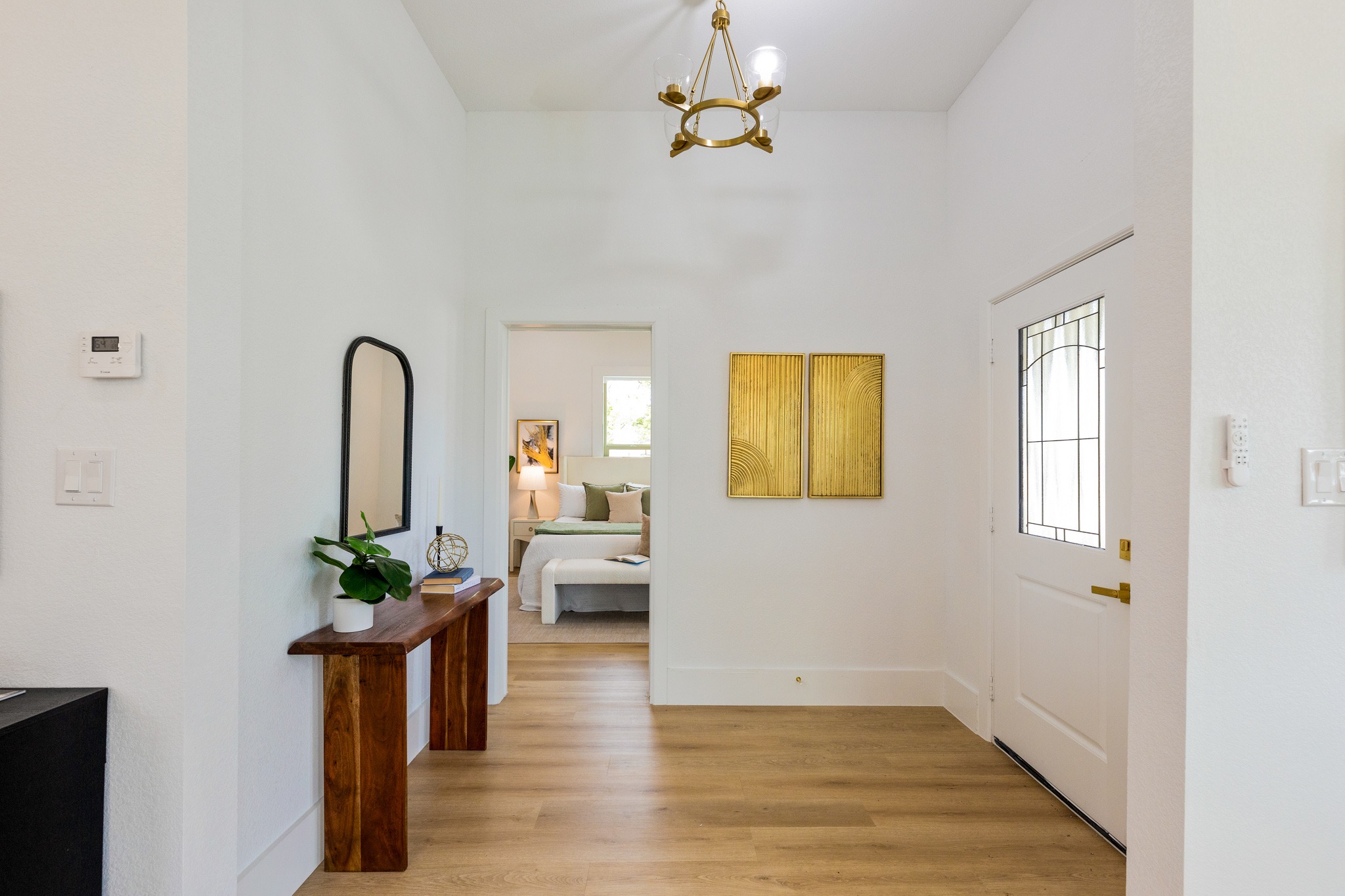 910 West 4th Street Taylor, TX 76574 - Photo 32 of 38 a view of an entryway with wooden floor