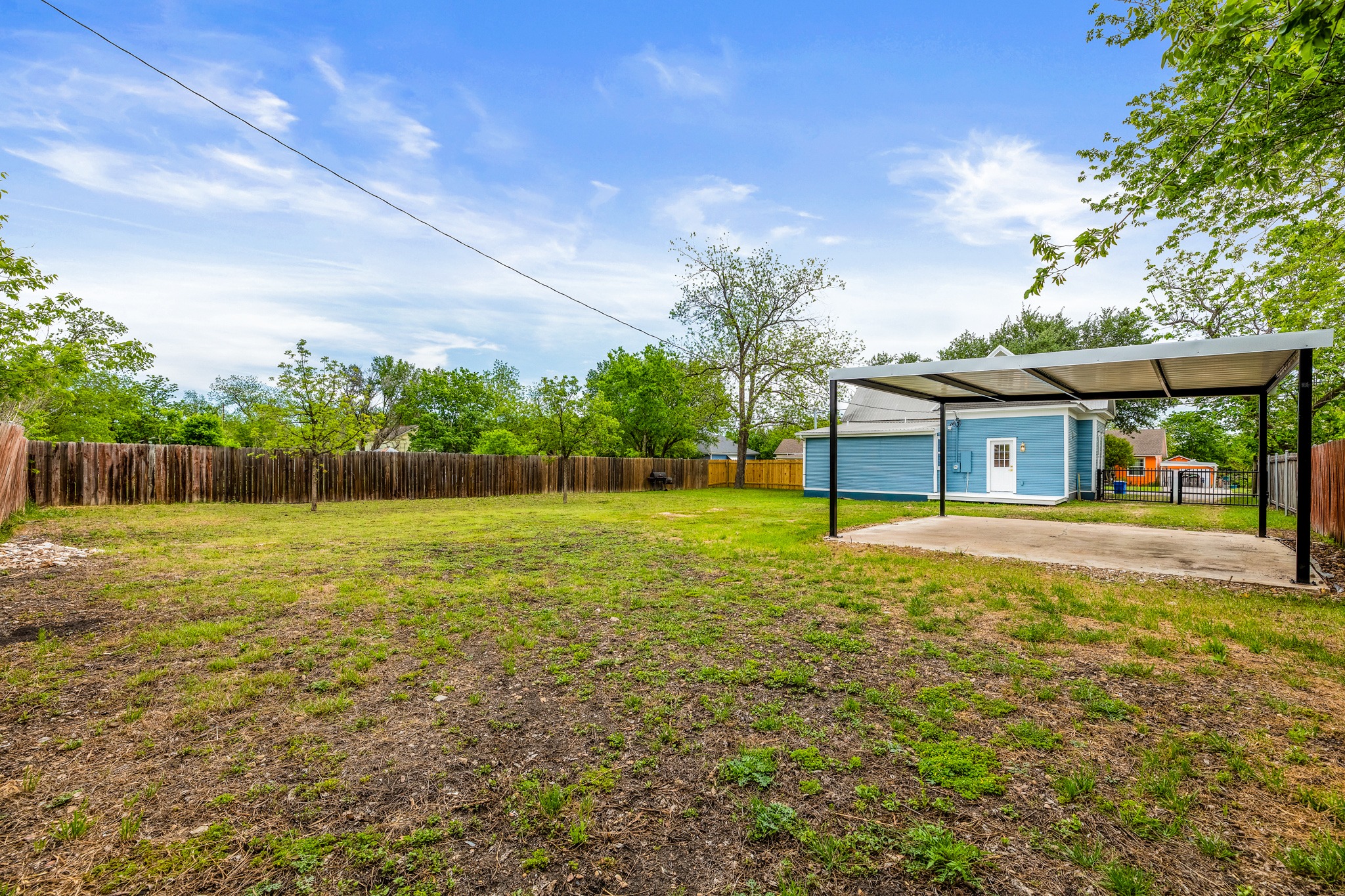 910 West 4th Street Taylor, TX 76574 - Photo 37 of 38 a view of a house with backyard and a tree