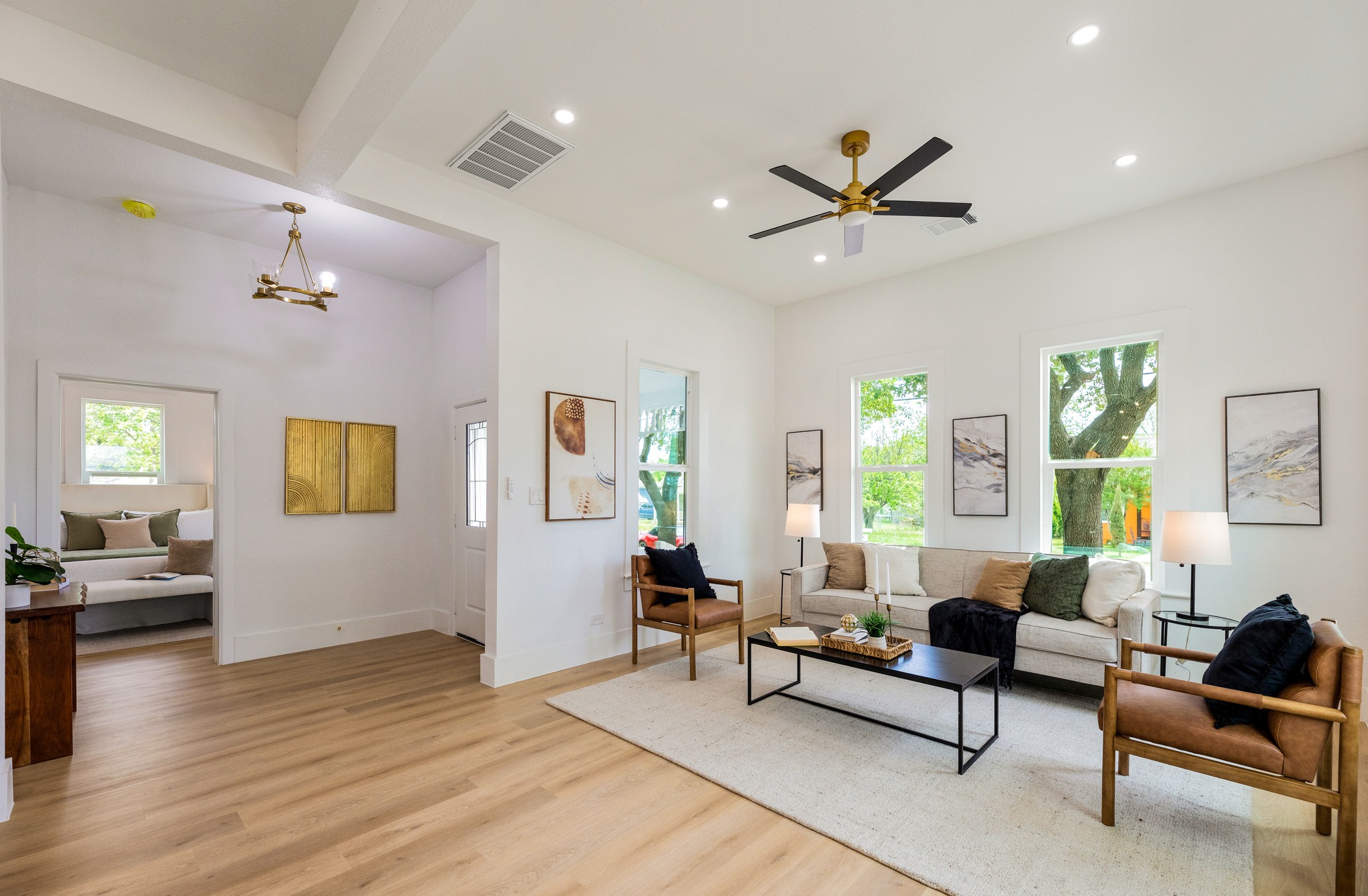 910 West 4th Street Taylor, TX 76574 - Photo 7 of 38 a living room with furniture and a wooden floor