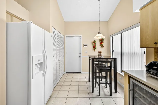a kitchen with stainless steel appliances a refrigerator and a stove