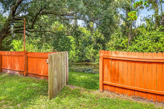 a backyard of a house with lots of green space