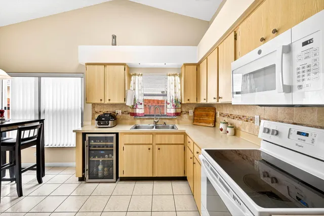 a kitchen with a stove a sink and a refrigerator