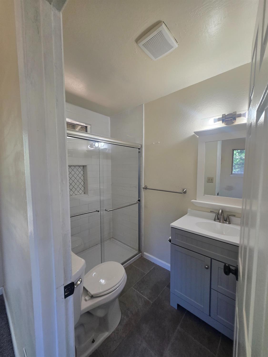 10601 Lime Kiln Road Grass Valley, CA 95949 - Photo 36 of 79 Second ensuite bathroom. Features a tile shower and glass doors.