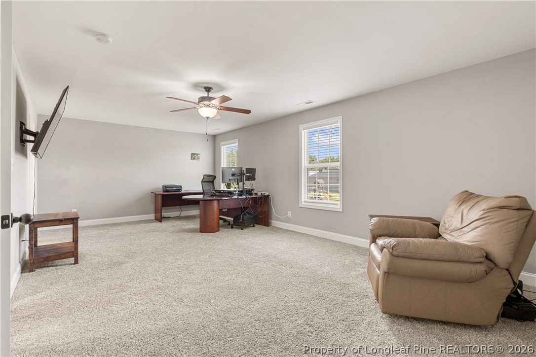 137 Minter School Road Sanford, NC 27332 - Photo 29 of 50 a living room with furniture and a ceiling fan