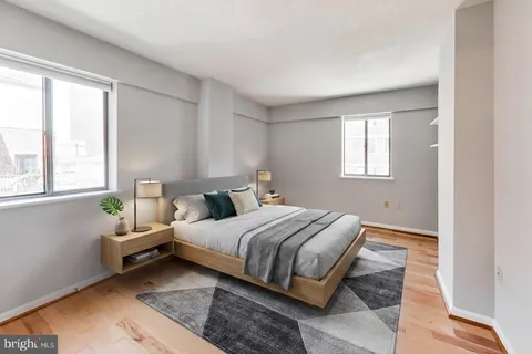 a bedroom with a bed and window