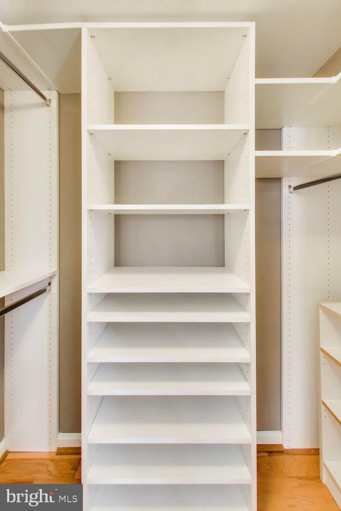 1225 13th Street Northwest, Unit 506 Washington, DC 20005 - Photo 15 of 18 a view of walk in closet with empty racks