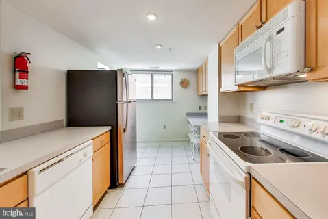 a kitchen that has a sink and a stove