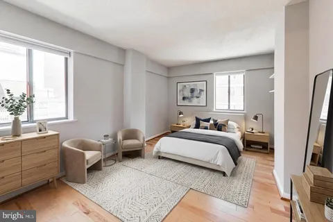 a bedroom with a bed and a couch