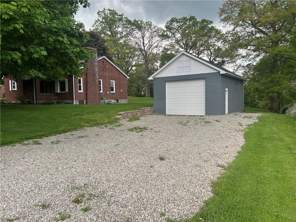 1023 Bonniebrook Road Butler, PA 16002 - Photo 18 of 40 a view of a house with a yard and large tree
