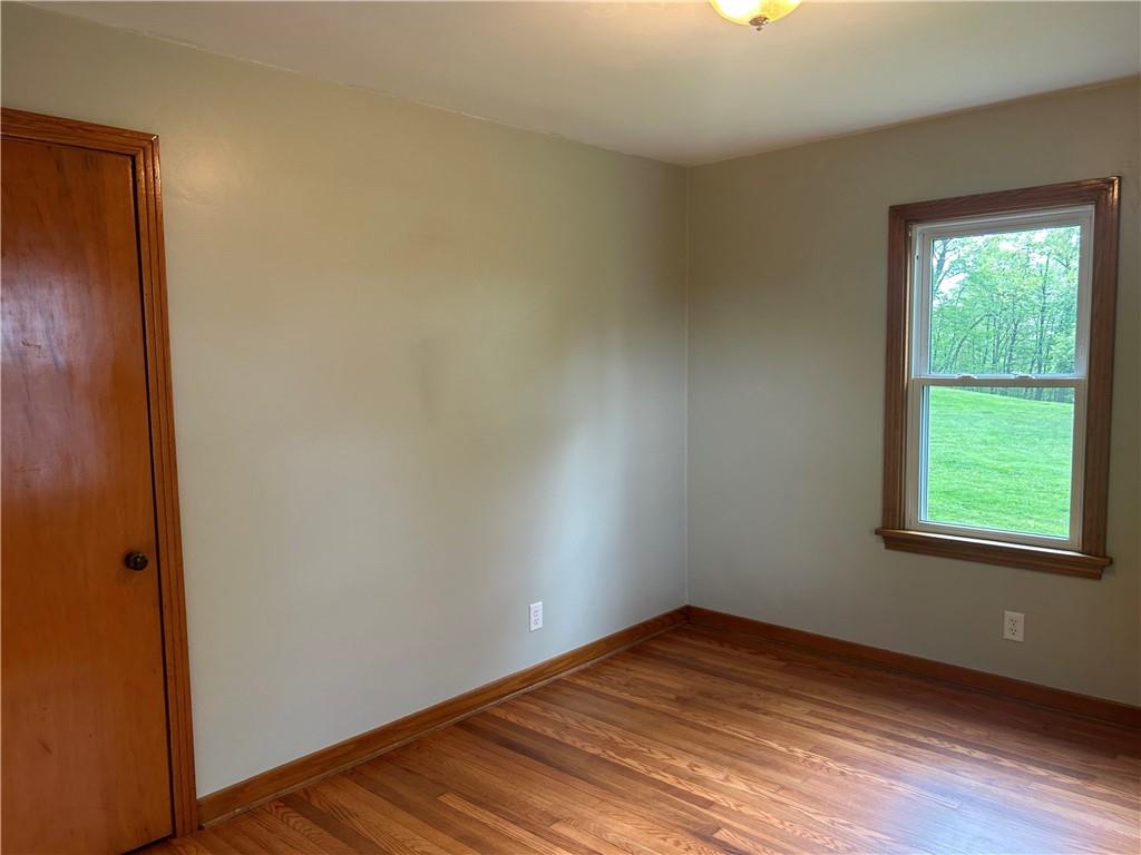1023 Bonniebrook Road Butler, PA 16002 - Photo 27 of 40 an empty room with wooden floor and windows