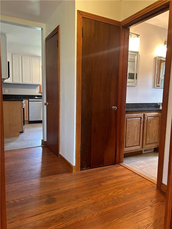 1023 Bonniebrook Road Butler, PA 16002 - Photo 29 of 40 a view of a hallway with wooden floor and cabinet