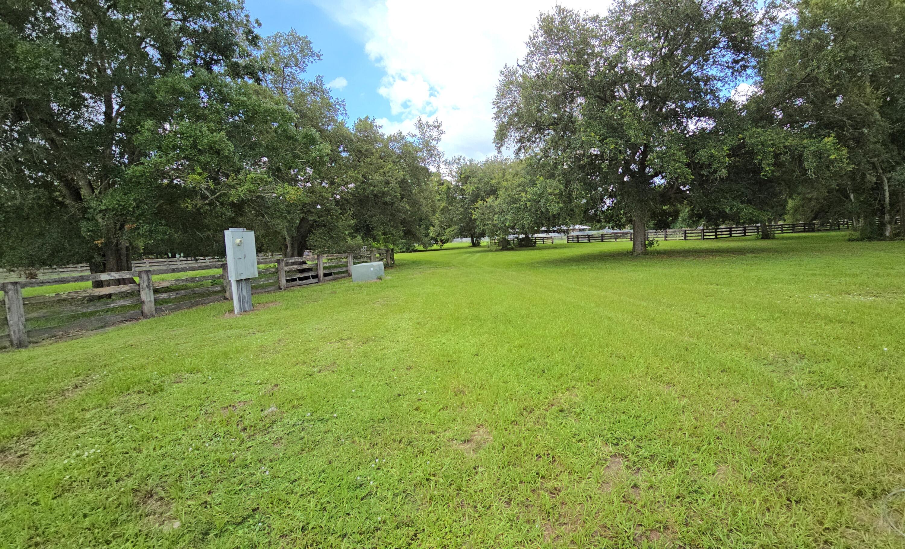 4567 Highway 710 Okeechobee, FL 34974 - Photo 37 of 51 a backyard of a house with lots of green space