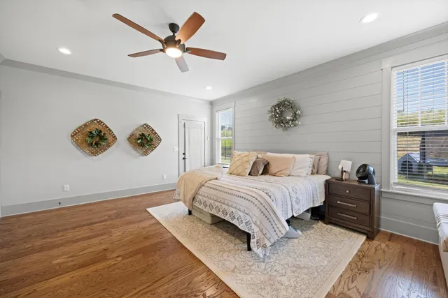 a spacious bedroom with a bed and a window