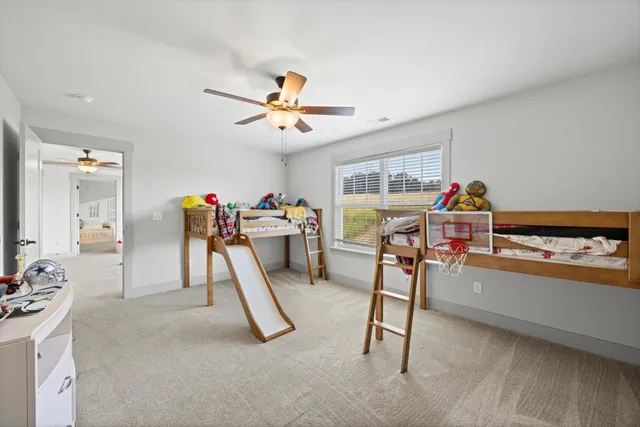 a bedroom with furniture and a wooden floor