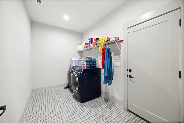 a view of a storage & utility room with a sink