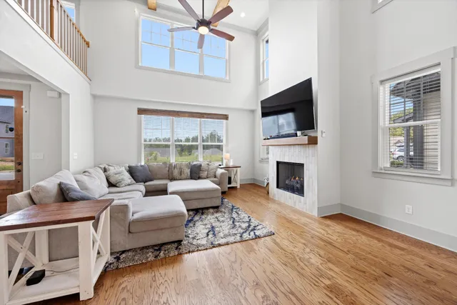 a living room with furniture fireplace and flat screen tv