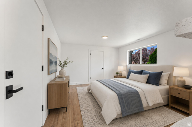 1898 West 600 South Provo, UT 84601 - Photo 24 of 32 Bright bedroom featuring wood-finish flooring, white walls, and a window offering natural light
