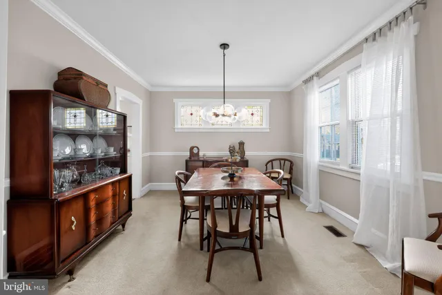 a view of a workspace with furniture and wooden floor