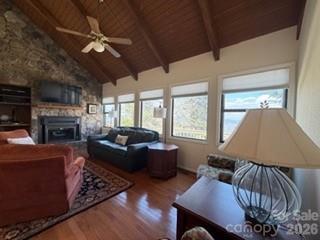 19 Lookout Loop Burnsville, NC 28714 - Photo 11 of 30 a living room with furniture a fireplace and a large window