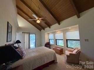 19 Lookout Loop Burnsville, NC 28714 - Photo 16 of 30 a bed room with a bed window and a chair